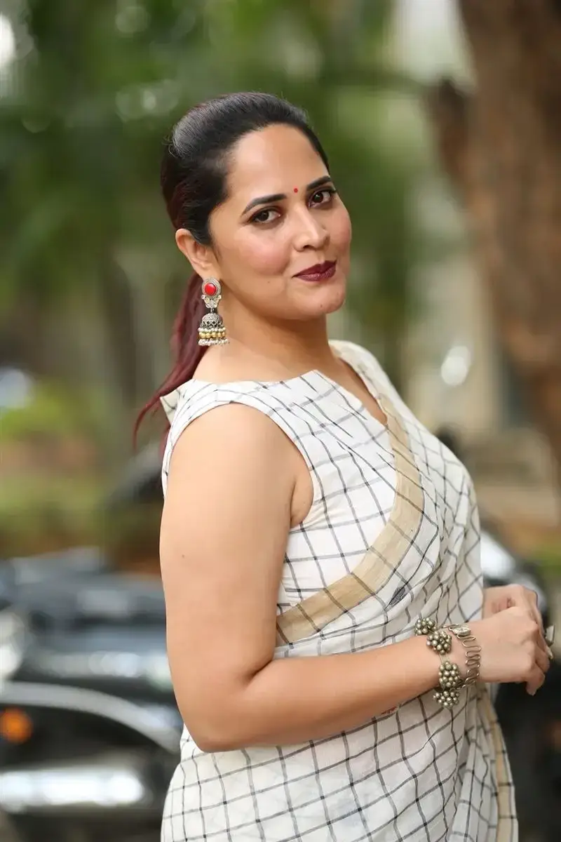 Anasuya Bharadwaj in White Saree at Razakar Movie Launch